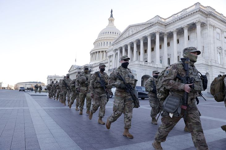 USA BIDEN INAUGURATIONepa08950432 Members of the National Guard walk on the East front of the US Capitol as preparations continue for President-elect Joe Biden's inauguration ceremony at the US Capitol in Washington, DC, USA, 19 January 2021. EPA/ERIK S. LESSER