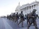 USA BIDEN INAUGURATIONepa08950432 Members of the National Guard walk on the East front of the US Capitol as preparations continue for President-elect Joe Biden's inauguration ceremony at the US Capitol in Washington, DC, USA, 19 January 2021. EPA/ERIK S. LESSER
